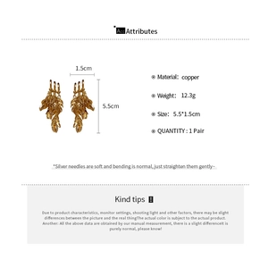 Detail specifications of golden geometric tassel earrings with size and material info