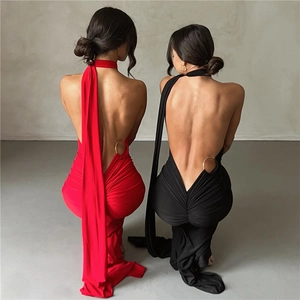 Back view of backless halter dress with fishtail hem and metal ring waist detail