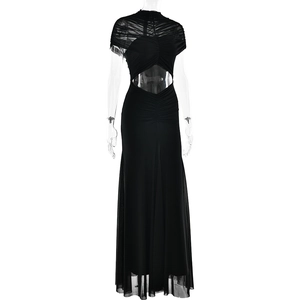 Detail of elegant black maxi dress featuring ruched mesh fabric and waist cutout accents