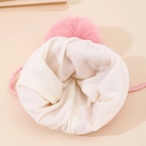 Winter knit hat for girls featuring a pink faux fur pompom and warm fleece lining