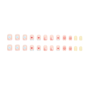 Cute heart and polka dot press-on nail set with 24 blue, pink and yellow short nail tips