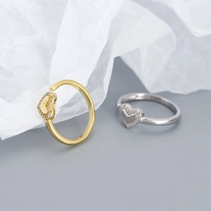 Macro view of S925 sterling silver heart rings with cubic zirconia and engraved hallmark
