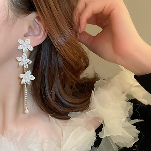 Elegant lily flower earrings with white shell petals, pearl tassels and silver needles