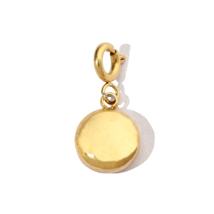 Detailed view of a golden tree of life pendant with refined hammered metal texture