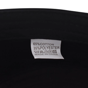 Detail view of cotton blend fabric label showing material composition on cadet cap