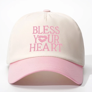 Detailed embroidery of BLESS YOUR HEART text on two-tone cotton baseball cap