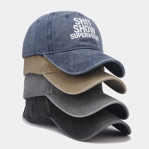 Washed vintage baseball caps set in four colors with embroidered typography print