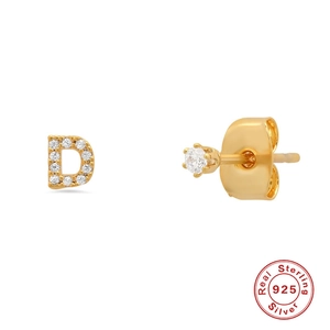 Detail of S925 sterling silver gold stud featuring letter D and sparkling zircon