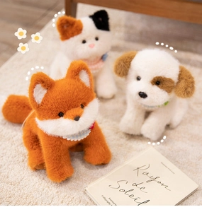 Close-up of adorable plush fox, cat and puppy dolls with soft faux fur and scarves