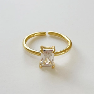 Minimalist gold adjustable ring featuring a classic rectangular emerald-cut zircon stone