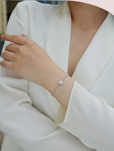 Elegant 925 sterling silver adjustable bracelet with multiple round cut diamonds on wrist