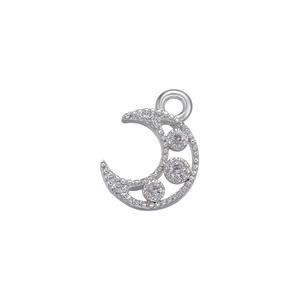 Macro shot of silver crescent moon pendant with micro-paved sparkling cubic zirconia stones