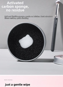 Detail of activated carbon sponge in silver metal tin for dry makeup brush cleaning