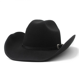 Detail of western cowboy hat with black textured leather band and carved silver buckle