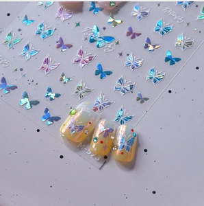 Detail of laser butterfly nail stickers with shell glow and iridescent finish M-573