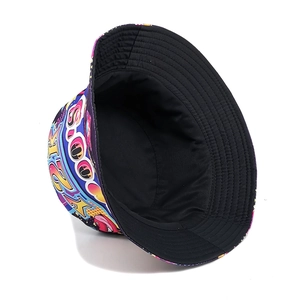 Reversible bucket hat featuring vibrant 2000s graffiti print and a plain black canvas side