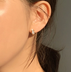 Minimalist 925 sterling silver stud earrings with rectangular zircons on female model