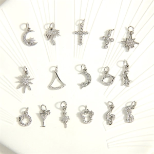 Silver plated pendants with cubic zirconia including moon, star and cross shapes
