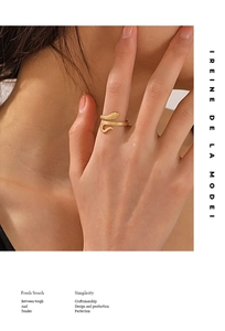 Detail showing the intricate snake scales and golden finish of the adjustable ring