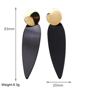 Macro detail showing long black leaf drop earrings with dimensions 83mm height and 20mm width