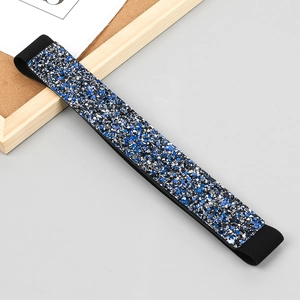 Macro detail of sparkling blue and silver sequins on a flexible elastic fashion belt