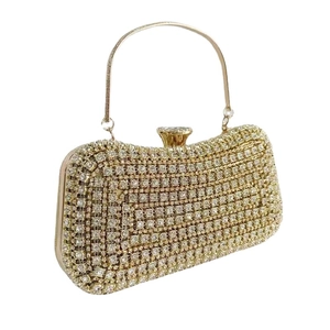 Elegant gold evening clutch bag with sparkling rhinestones and metal ring handle