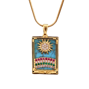 Golden sun tarot pendant necklace with colorful zircons and blue enamel detail