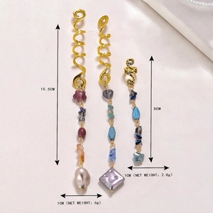 Golden snake-shaped hair spirals with natural crystal pendants and pearl accents