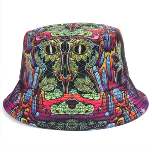 Reversible bucket hat featuring vibrant graffiti print and surreal cat-eye pattern design