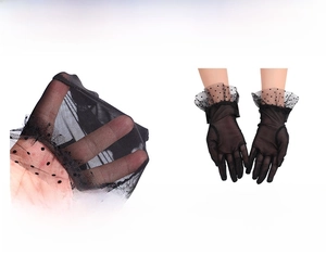 Detail of black polka dot mesh gloves with elastic wrist trim and fine stitching