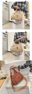 Detail view of multi-compartment casual tote with shoulder strap in beige and red