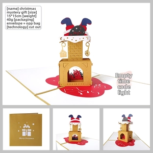 Detail of 3D pop-up Christmas card with laser-cut chimney design and golden envelope