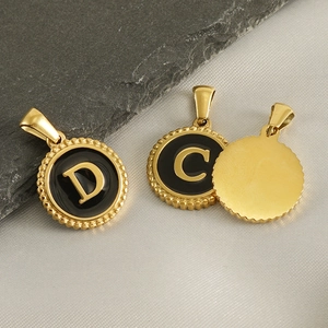 Classic 18K gold plated round pendant with black enamel letter D and C detail