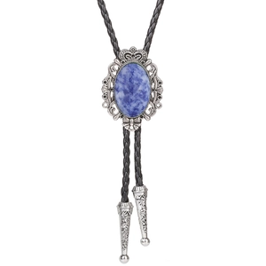 Detail of blue oval turquoise stone in silver crown bezel on a black leather bolo tie