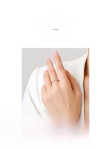 Detail of elegant S925 sterling silver wave ring with micro-pave cubic zirconia on hand
