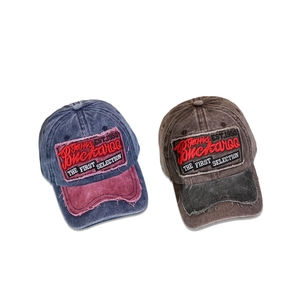 Vintage washed cotton baseball caps with embroidered patches and distressed brim detailing