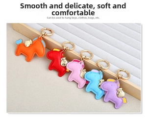 Detailed view of horse-shaped leather keychains in five colors with golden lucky charms
