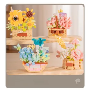Close-up of assorted building block flower pots including roses and tulips on a wooden rack