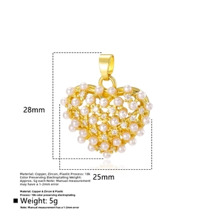 Detail of a hollow heart pendant with white pearls and zircons, size 28mm x 25mm