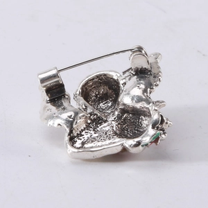 Rear view of vintage angel brooch in silver alloy with standard pin fastener detail