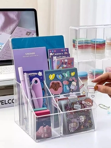 Close-up of transparent acrylic desktop organizer with multiple compartments for stationery