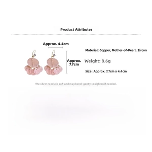Detail view of pink shell tassel earrings with zircon and copper materials and dimensions