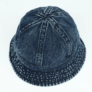 Vintage dark blue washed denim bucket hat with snowflake texture and reinforced brim