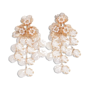Elegant gold flower tassel earrings with white pearl petals in a vintage drop design