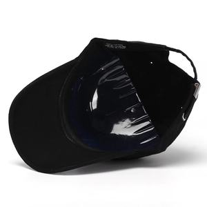 Black cotton baseball cap showing internal structure, cotton material, and metal buckle