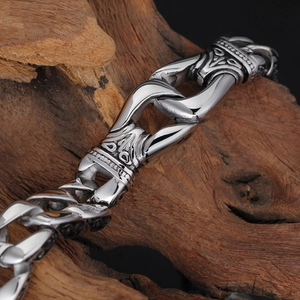 Close-up of vintage engraved patterns on heavy silver stainless steel chain links