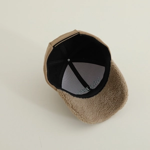 Detailed macro view of the soft lambswool brim and corduroy interior with Boston embroidery