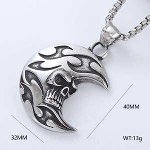 Macro detail of gothic moon skull pendant with flame texture in vintage silver finish