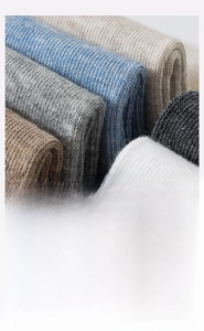 Detail of ribbed knit texture on combed cotton socks showing premium soft fabric