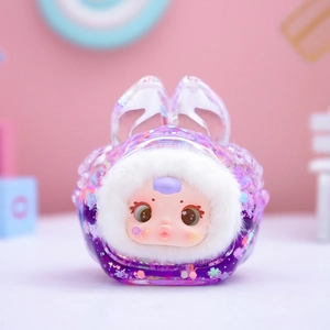Close-up of a cute doll head in purple glitter shell with white plush and bunny ears